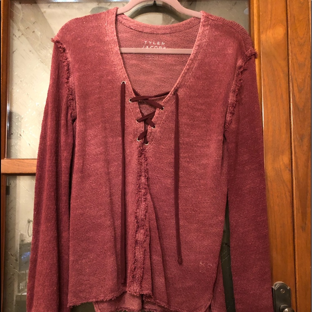 Tyler Jacobs for Feel the Piece burgundy top.